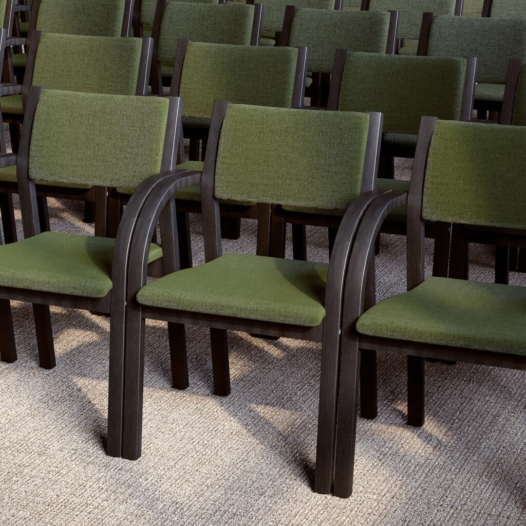 A row of classic visitors' chairs with a low back, green upholstery and a dark wood frame.