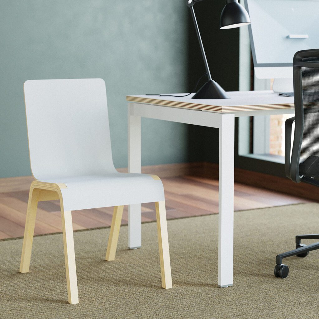 A white modern visitor's chair with a light wooden frame, placed next to the work table.