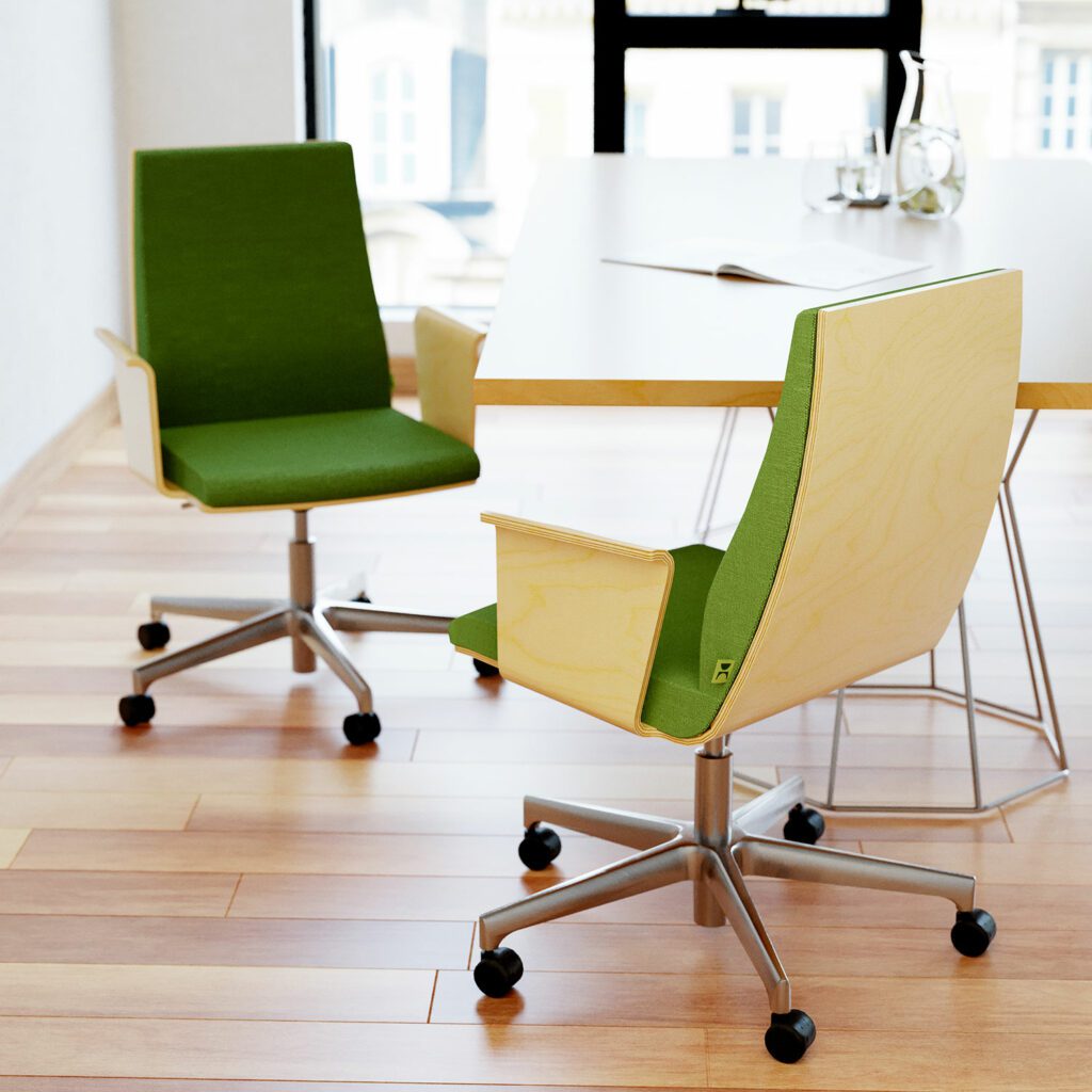 A conference chair with a low back and a green seat, placed next to the meeting table.